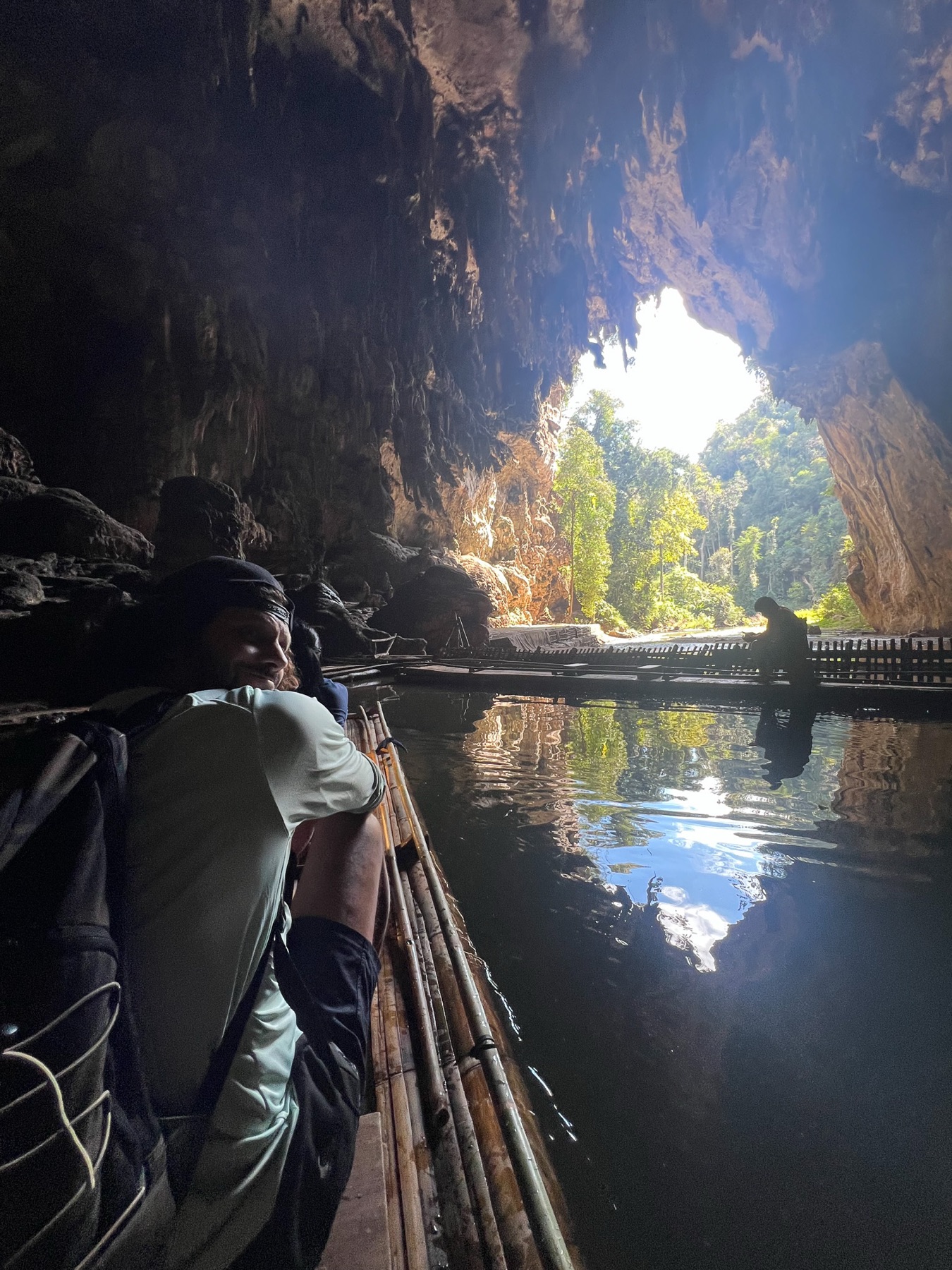 Lizzy East on a boat inside a sea cave
